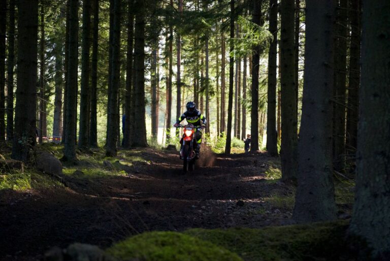 Dirt bike rider on a forest trail