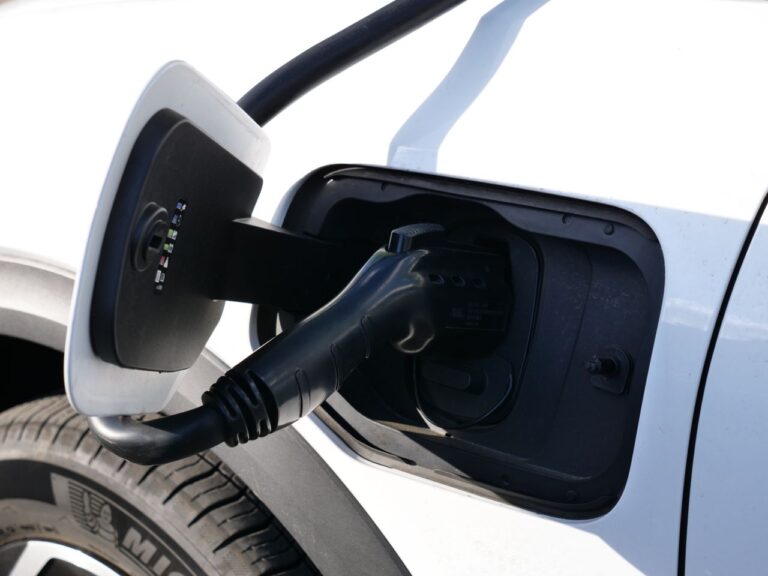 EV charge port and cable in sunlight