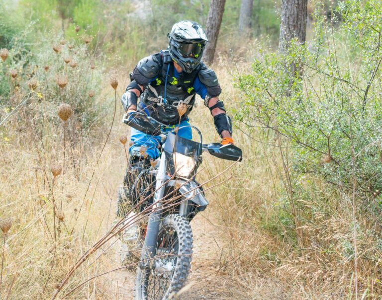 Rider on a narrow wilderness single-track trail