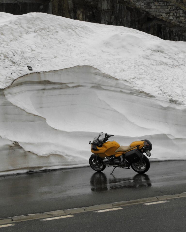 Motorcycle parked in deep winter snow