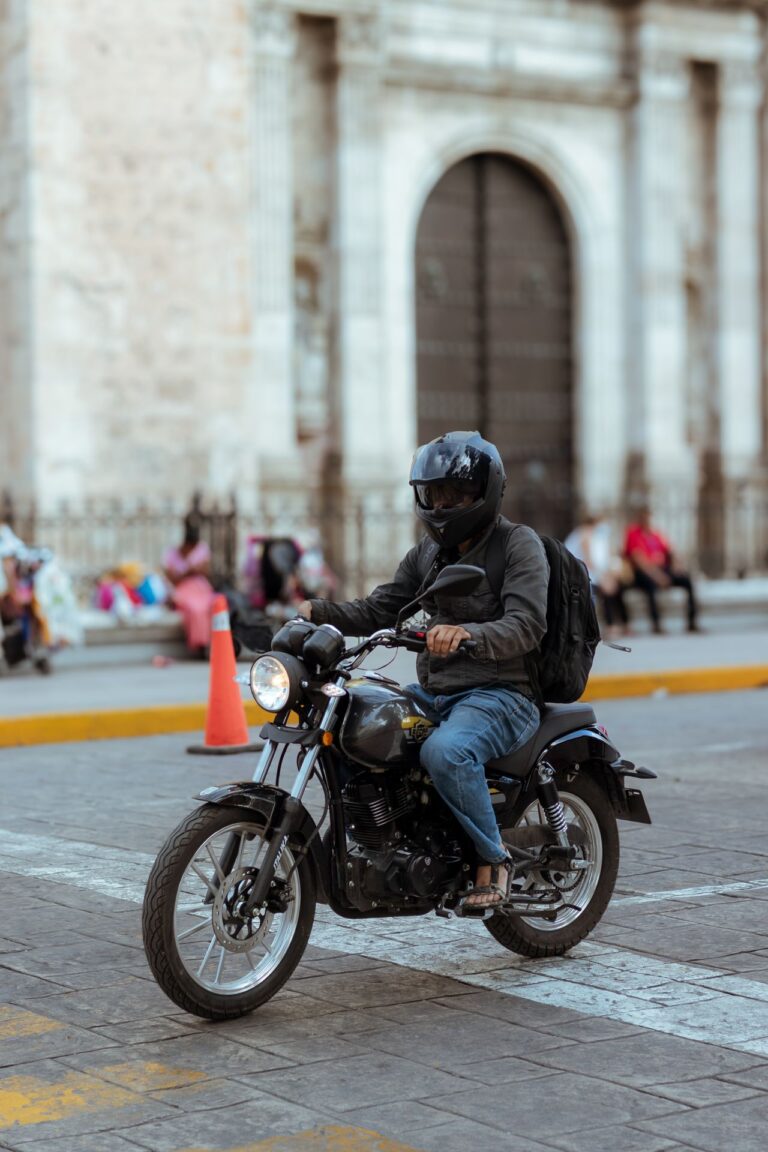 Rider passing historic city architecture