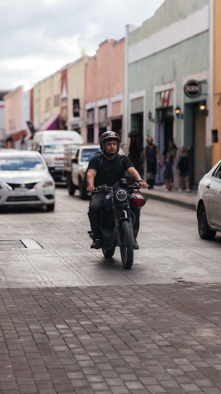 Rider on a busy colorful city street