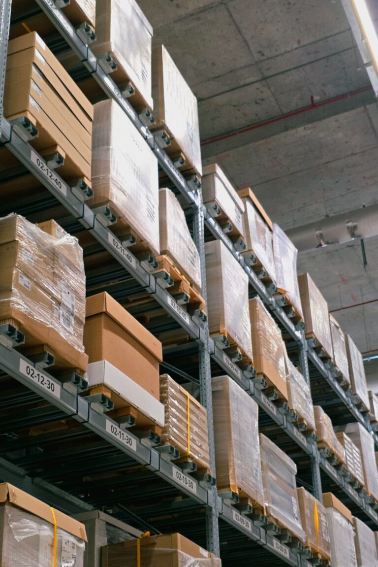 Warehouse shelves stacked with shipping boxes