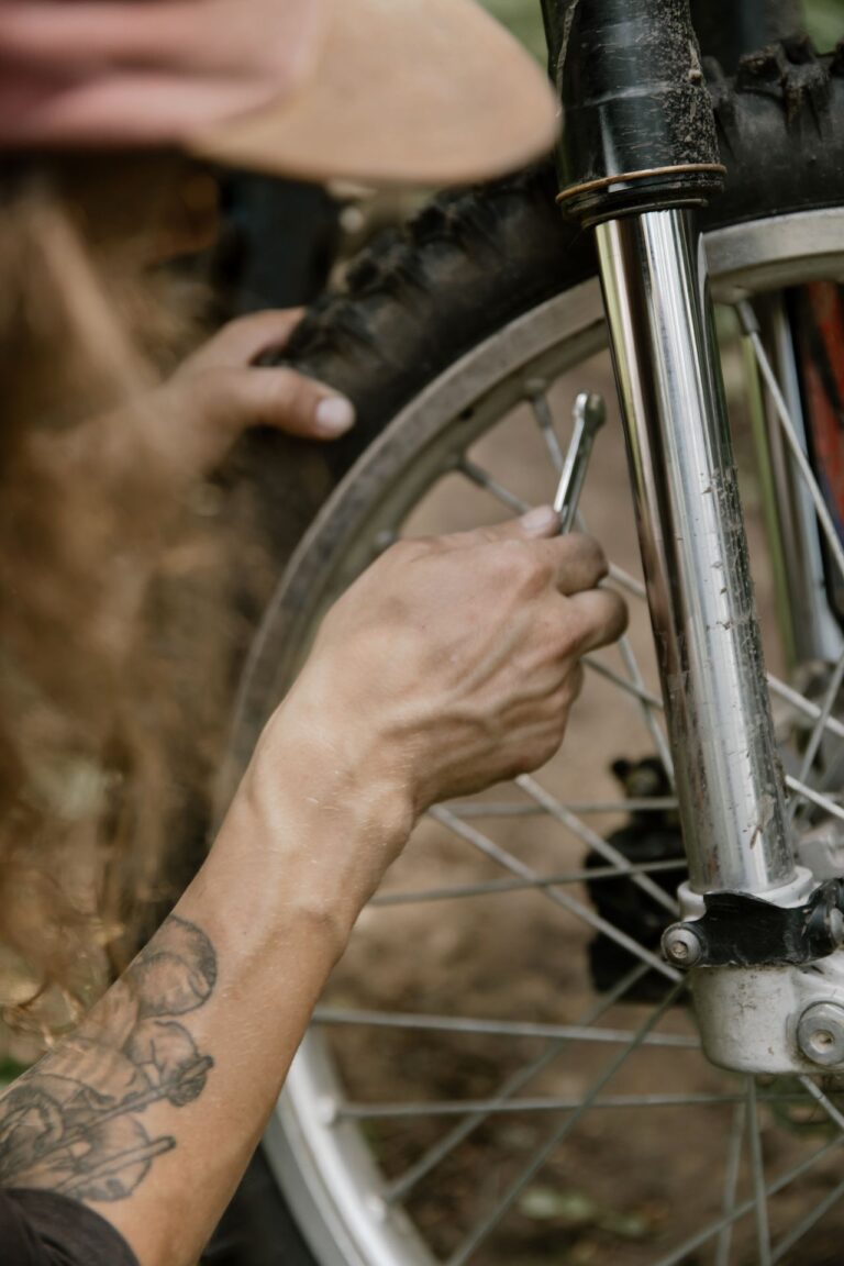 Mechanic working on wheel spokes